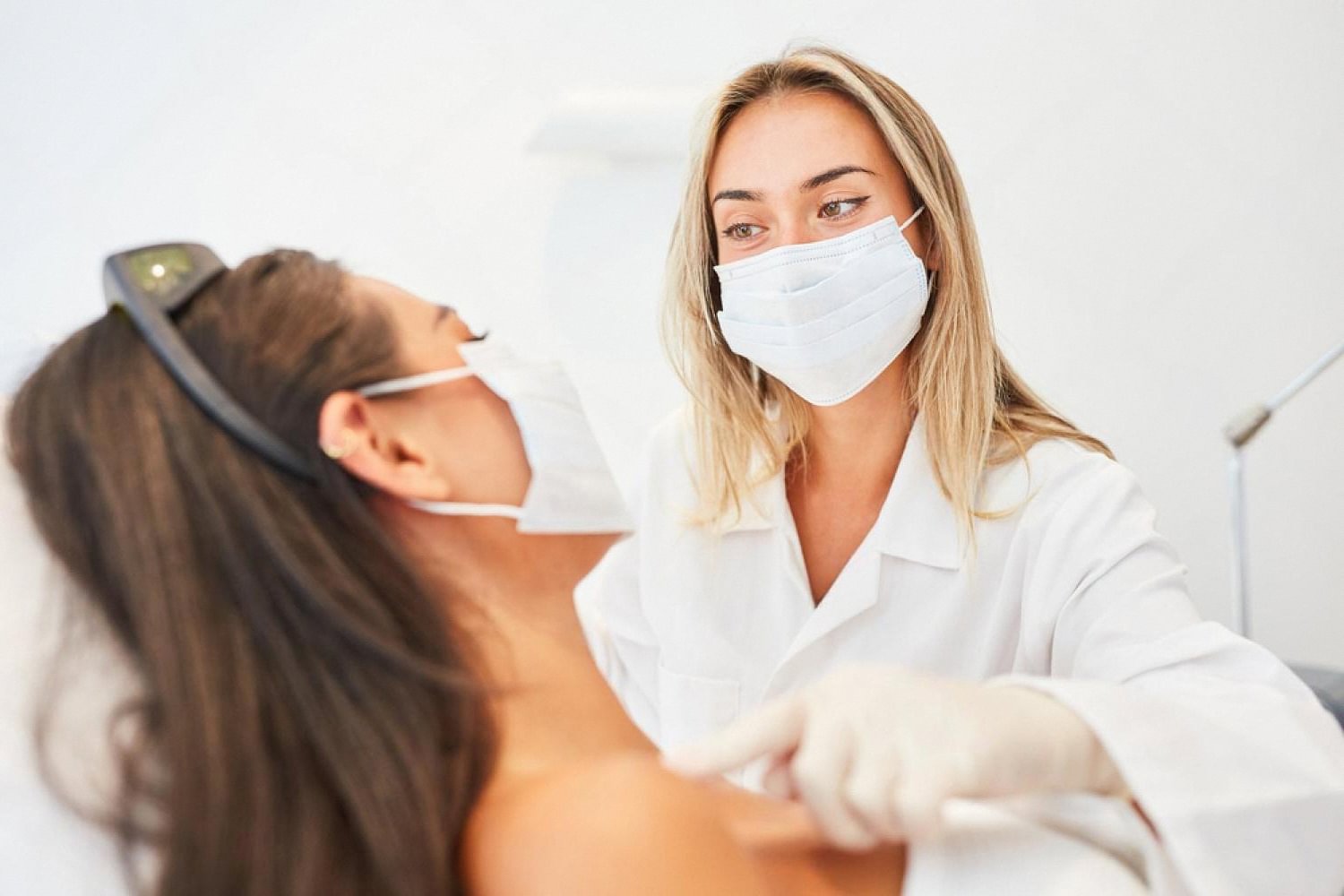 Dermatologist performing a laser skin treatment on a patient in a UAE dermatology clinic